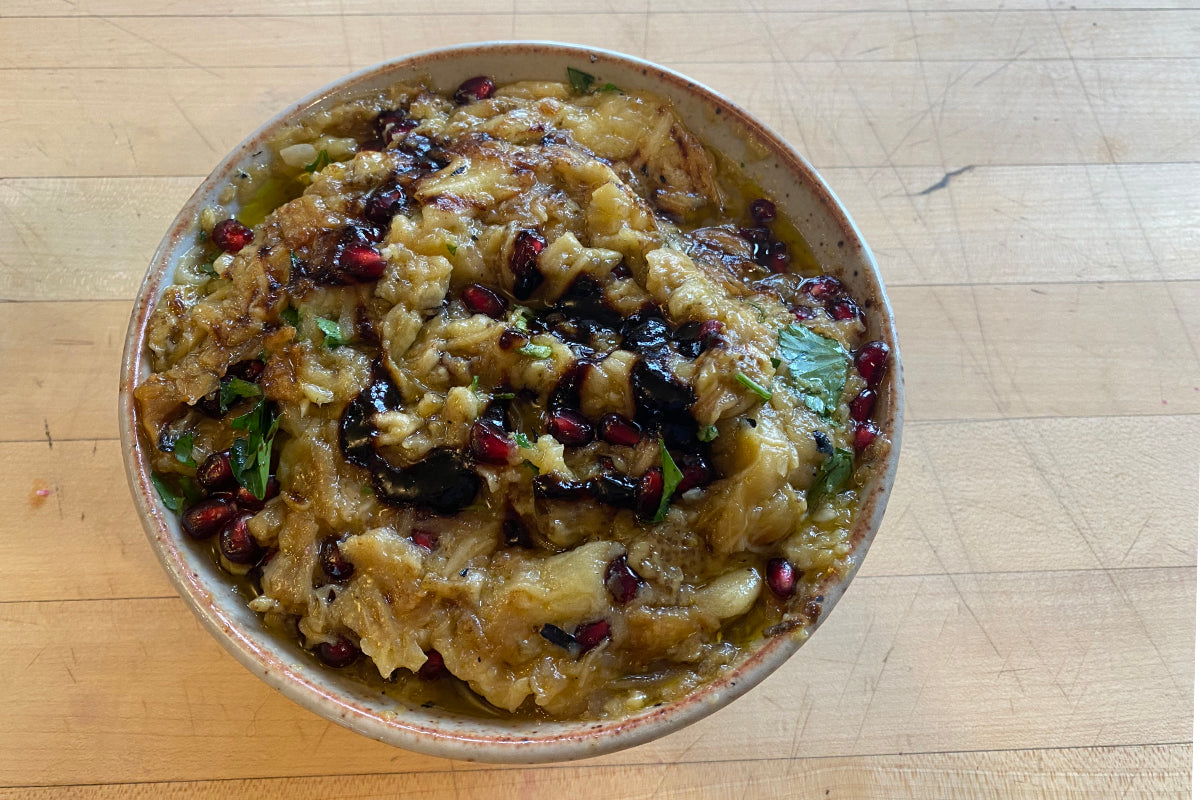 BURNT EGGPLANT WITH GARLIC, LEMON AND POMEGRANATE SEEDS